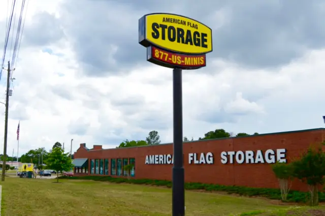 View of signage outdoors at American Flag Storage Cumberland.